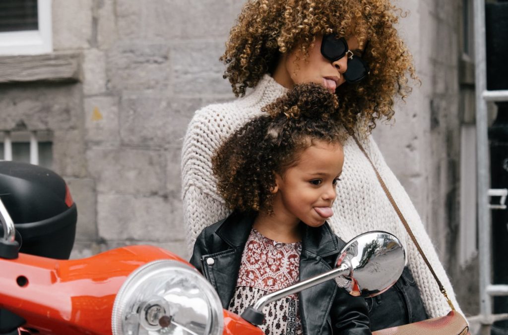 mom and daughter on a vespa