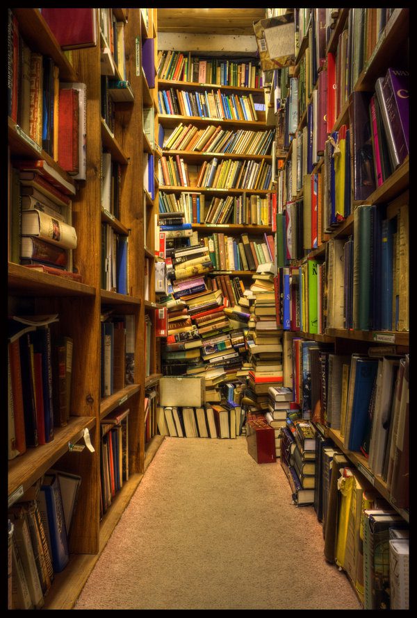 Books piled on shelves