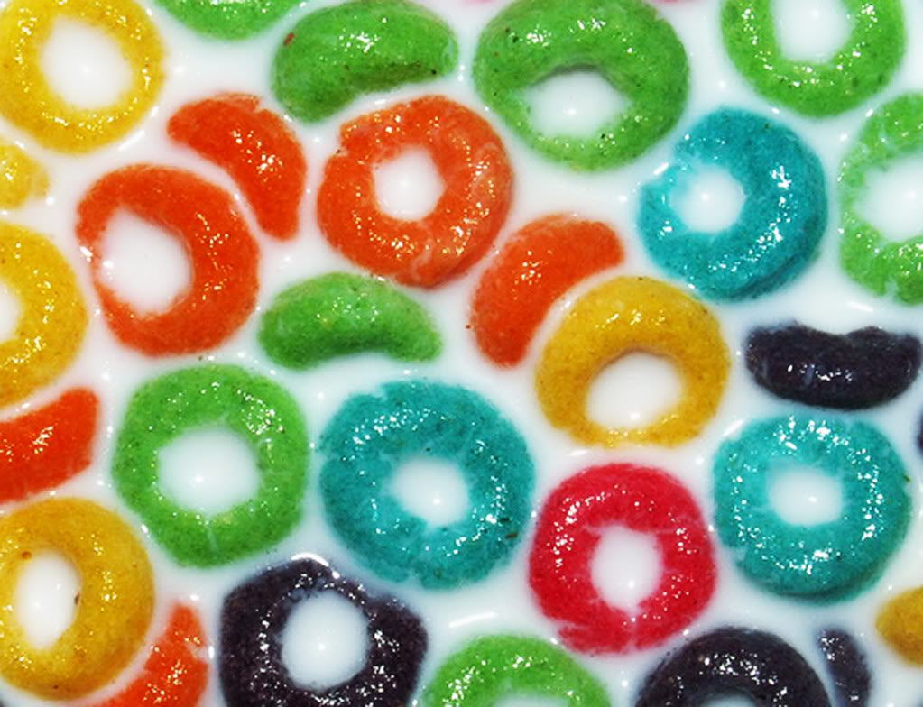 Close up of fruit loop cereal in milk.
