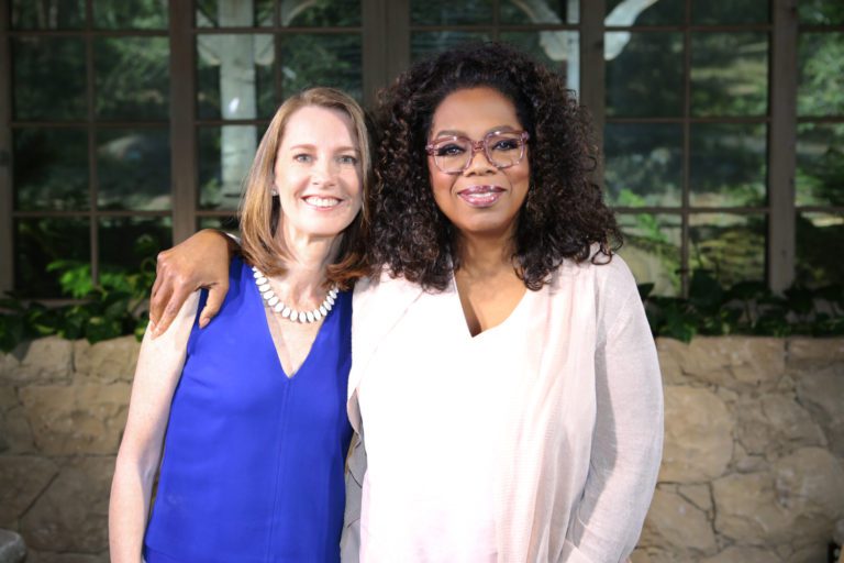 Gretchen and Oprah Winfrey standing side by side.