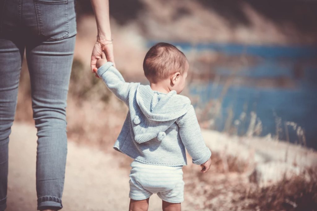 parent and child on a walk outside