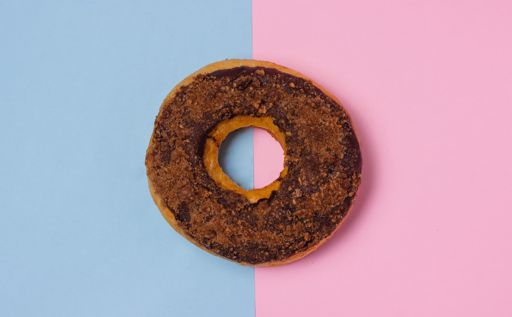 Donut on blue and pink background