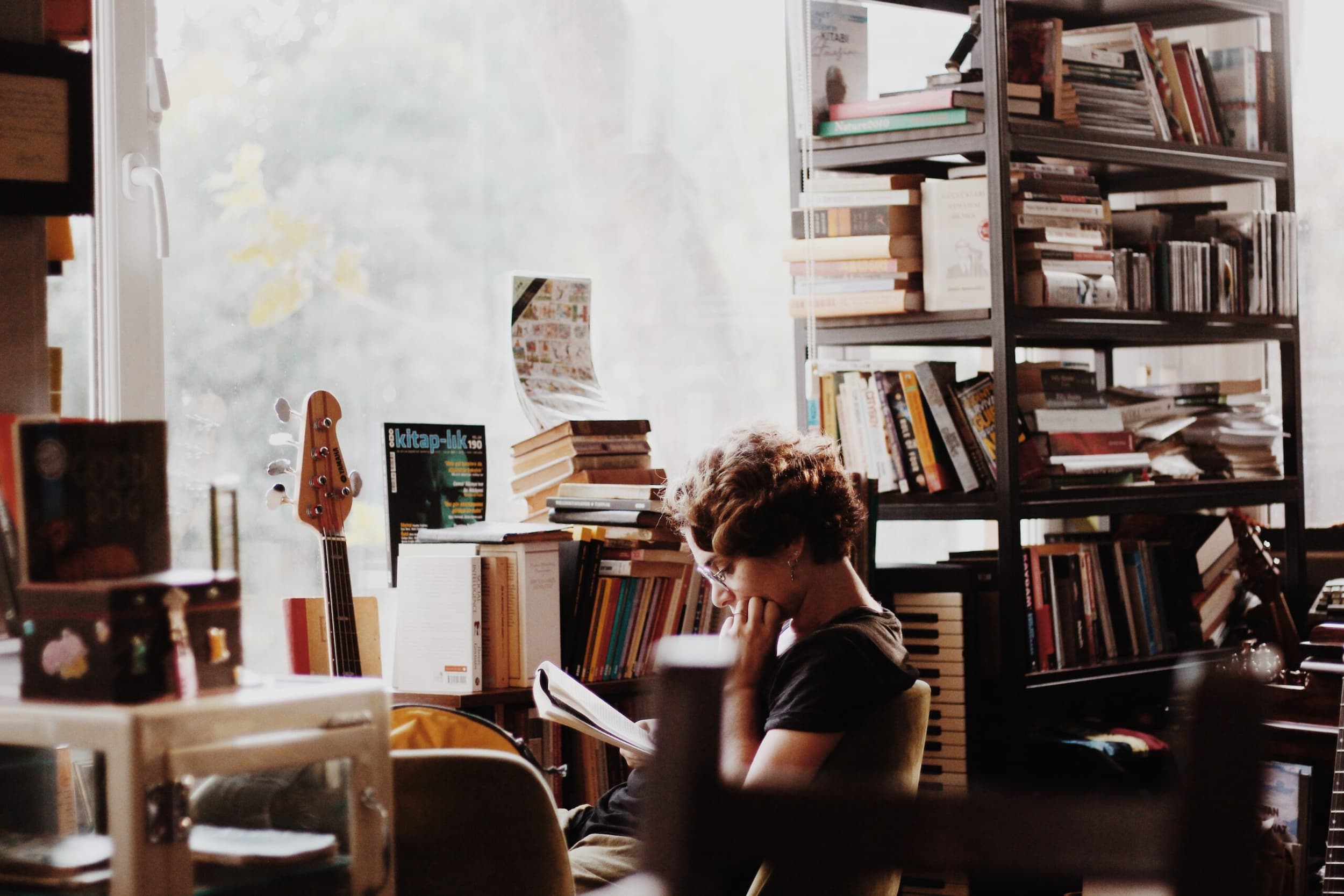 Photo of a person reading in a bookstore