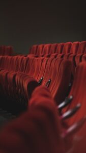 red fabric padded cinema chairs