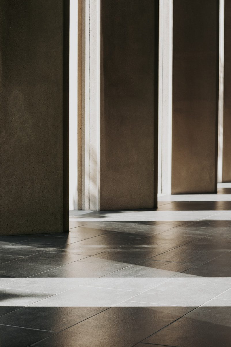 A man sitting on a bench in a building