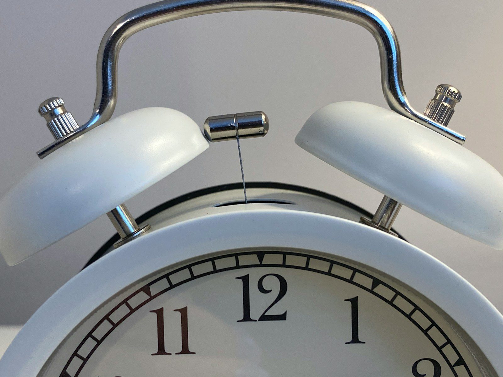 silver and white round analog clock