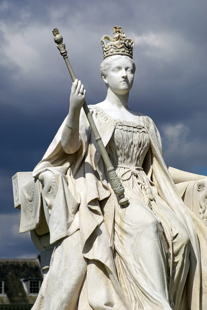 A statue of a woman holding a staff