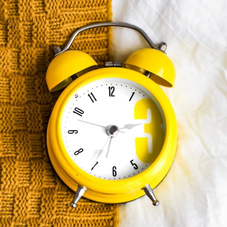 yellow and white alarm clock at 10 10