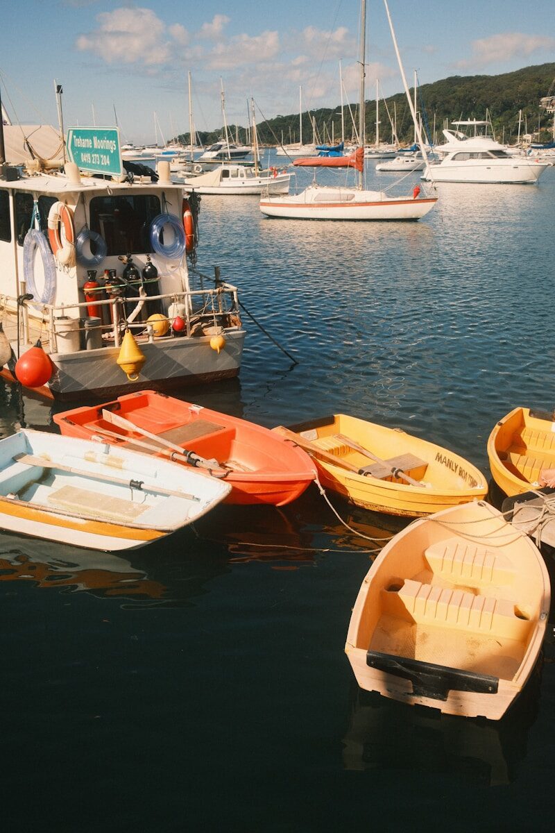 Several small boats moored near a larger vessel.