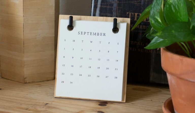 white braille paper on brown wooden table