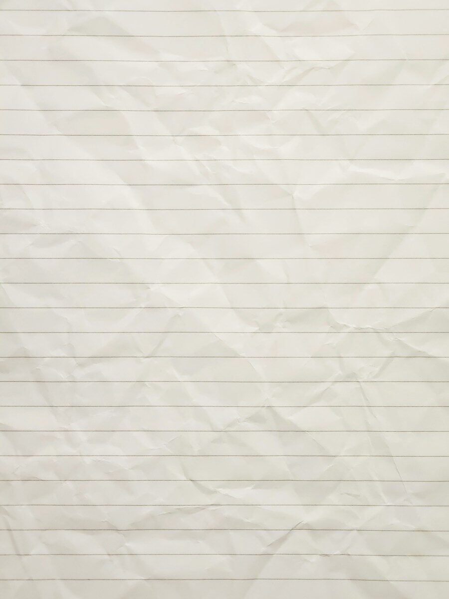 Crumpled, lined beige paper texture with visible wrinkles